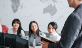 How is your deals. Group of people at business conference in modern classroom at daytime.