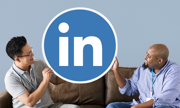 Diverse men holding browser icon sitting on couch