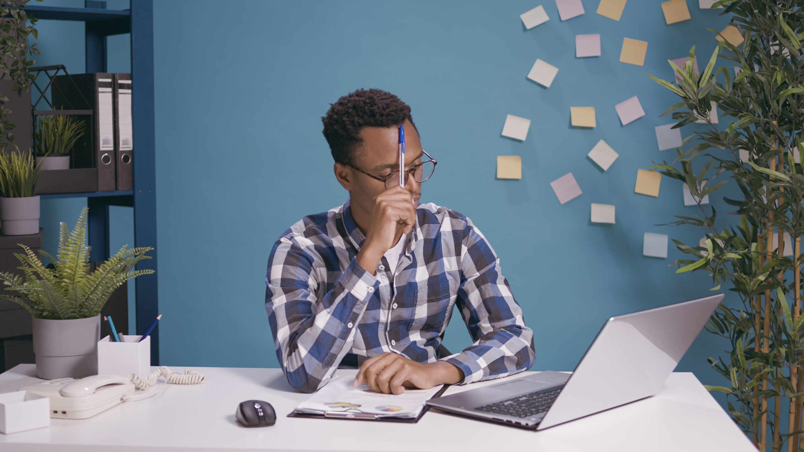 Thoughtful employee brainstorming ideas to plan business strategy