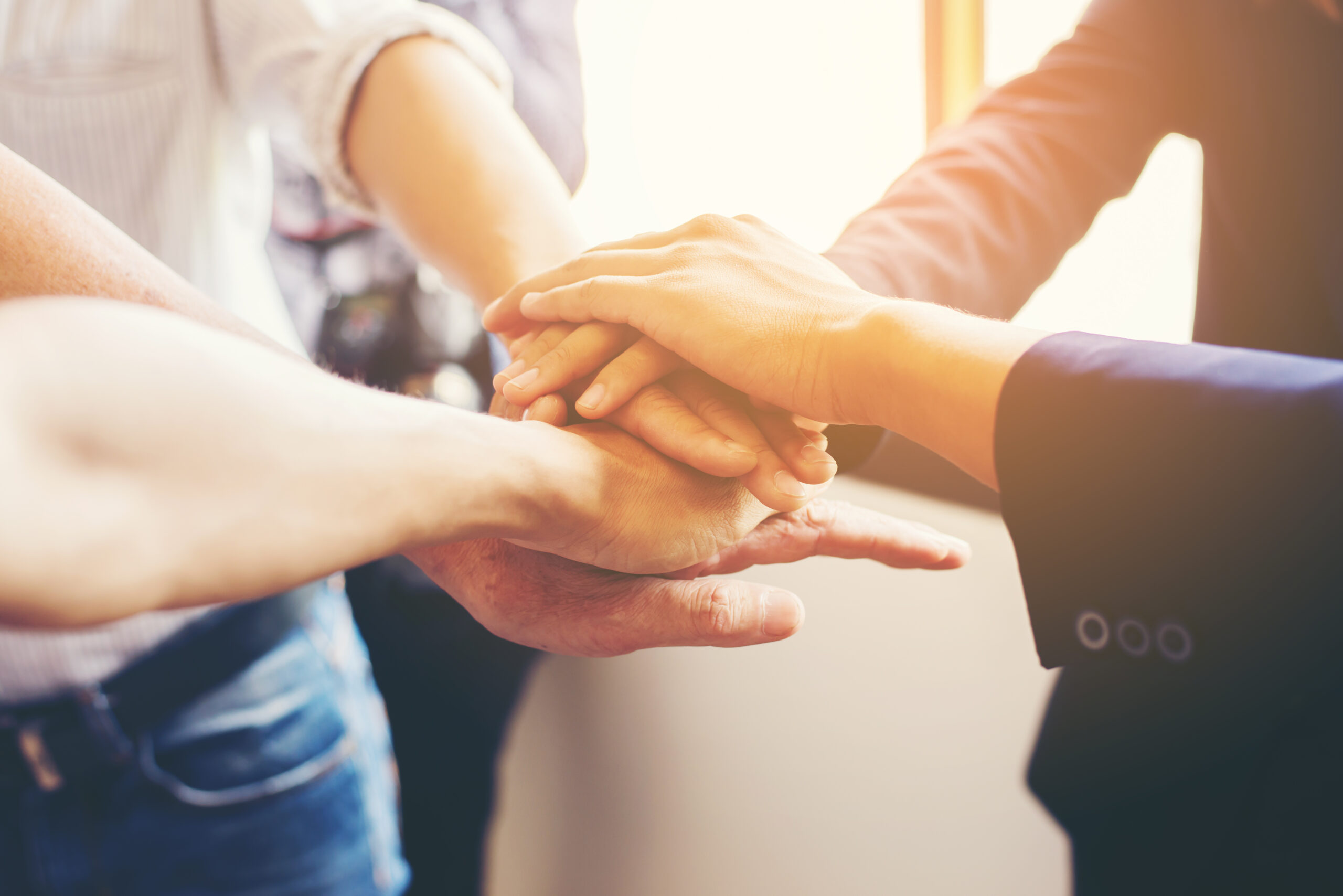 Concept of teamwork: Close-Up of hands business team showing un